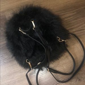 Black furry backpack with adjustable straps